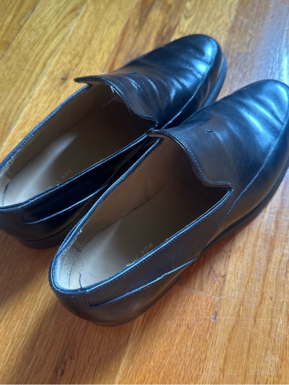 The Row Black Leather Slip-On Loafers